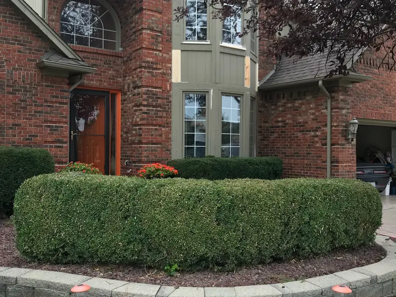 Brick two-story home with tall front windows